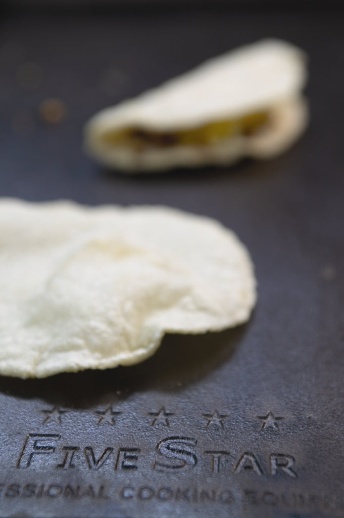 Cooking tortillas on the griddle